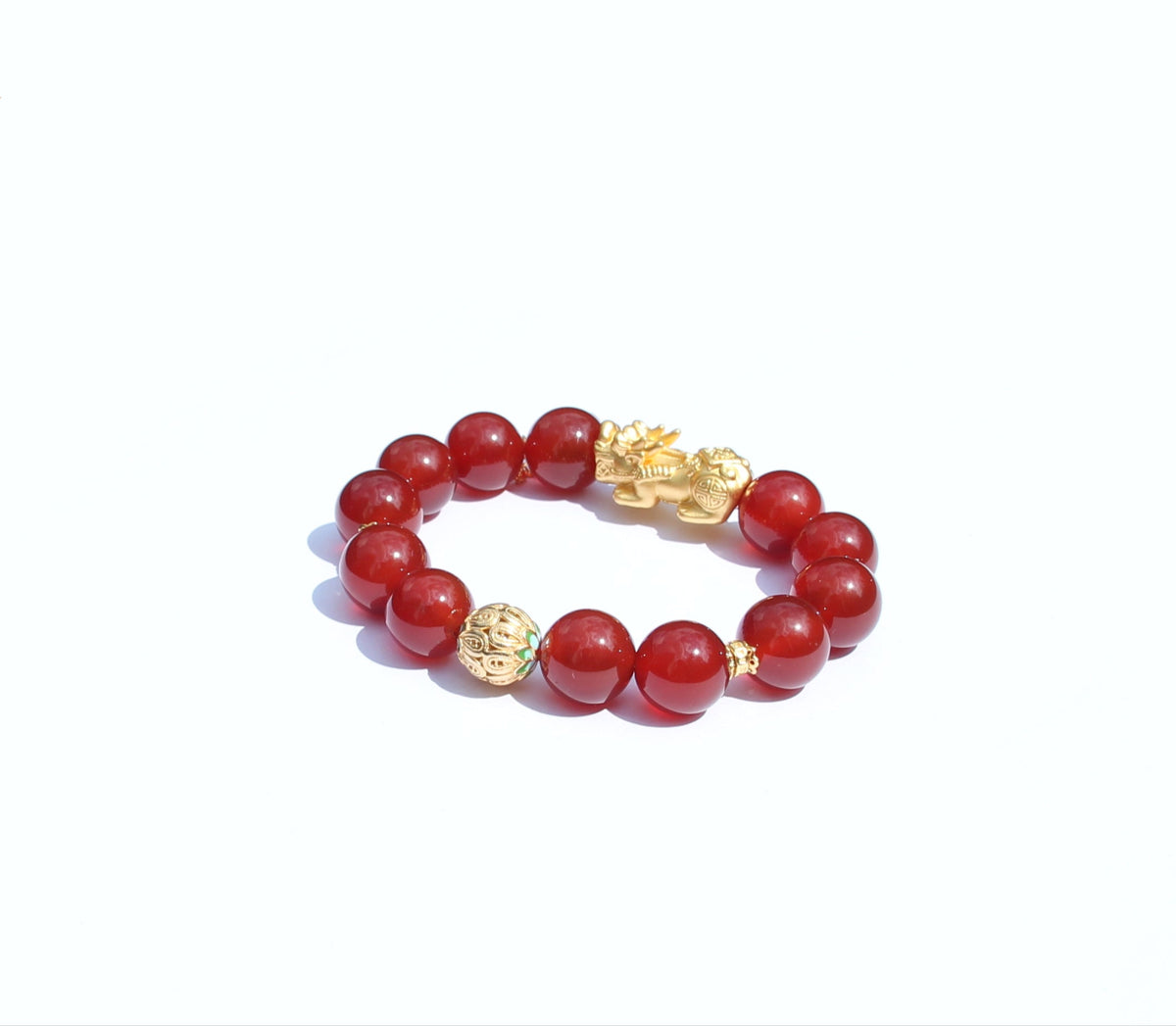 Close-up of red agate beads in warm flame-like tone