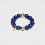 Lapis lazuli bracelet with gold-plated 925 Joy·Peace·Wellbeing charm and octagon wealth symbol