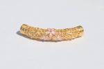 Lotus charm detail in 24K gold