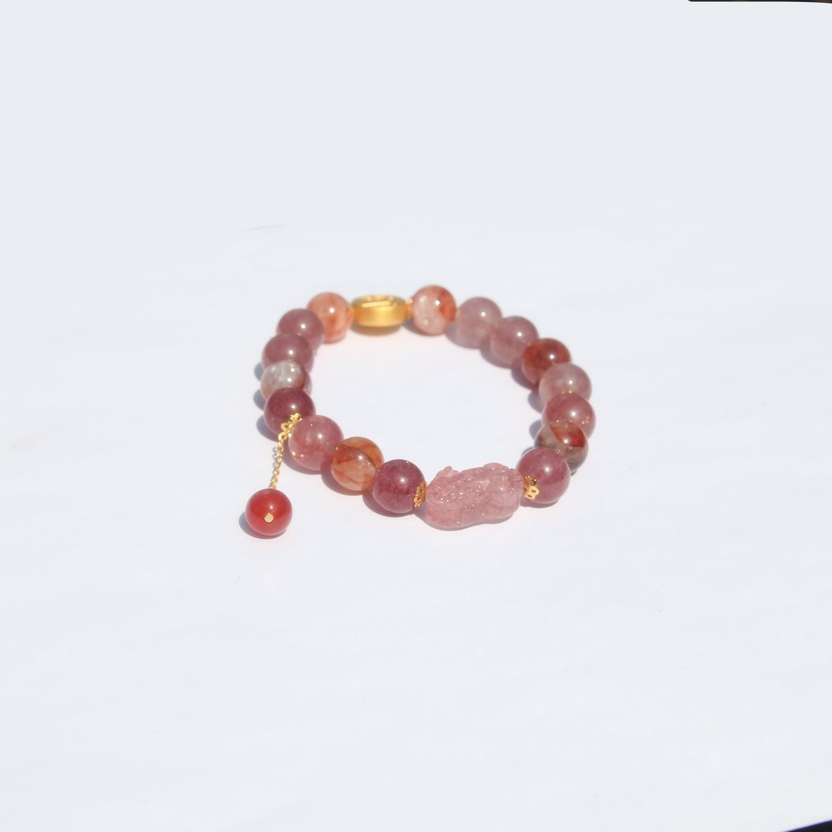 Pixiu charm detail on mica and red beads
